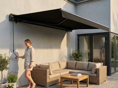 Black awning with crank handle for outdoor use