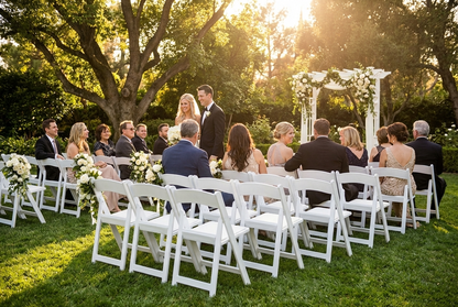 White padded folding chairs, ideal for indoor and outdoor events