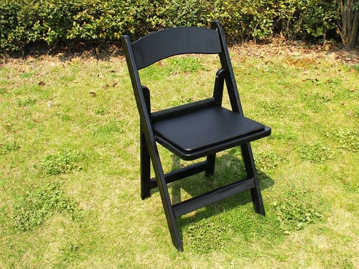 Black padded folding chairs suitable for commercial use