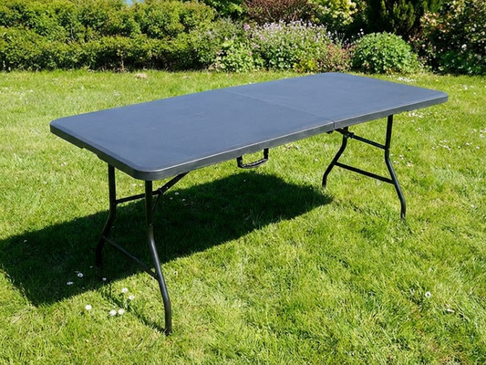 Black folding table made from HDPE and steel for indoor and outdoor use
